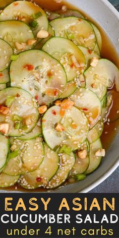 a bowl filled with cucumbers and sesame seeds