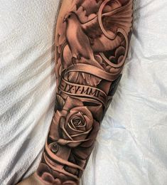 a man's arm with a rose and dove tattoo on it, which reads devamil