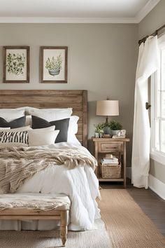 a large bed sitting next to a window in a bedroom on top of a rug