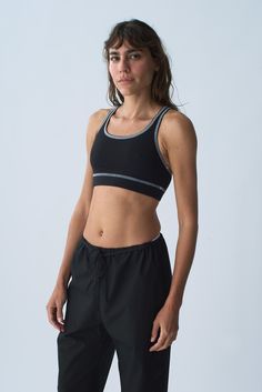 Our Organic Cotton Sport Bra provides full coverage, comfort and support for all activities. Finished with a racer back and 1 1/4 inch encased elastic hem. The Organic Cotton Sport Bra is manufactured in New York City. Fit notes – The Organic Cotton Sport Bra fits true to size, we recommend to take your normal size in a bra or sports bra style. Please follow measurements below to understand sizing. All measurements are in inches before stretch. Recommended Bra Sizing Across Chest Lying Flat (Pit Sporty Activewear With Light Support, Sporty Activewear With Built-in Padding For Training, Sporty Sports Bra For Training, Sporty Racerback Sports Bra With Medium Support, Sporty Racerback Sports Bra For Running, Sporty Sports Bra For Running With Medium Support, Sporty Medium Support Racerback Sports Bra, Medium Support Sports Bra For Running, Technical Stretch Racerback Sports Bra