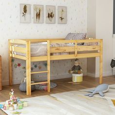 a child's bedroom with yellow bunk beds and toys on the floor in front of it