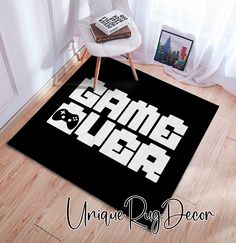 a black rug with the words video game geek on it in white letters next to a chair