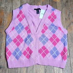 New With Tags! Knit Sweater Vest Featuring A Front Argyle Pattern, Ribbed Trim, And Button-Front Closures. - 100% Cotton Chest: 36"-42" Waist: 30"-36" Length: 17" Sleeve Opening: 18"-22" Purple Y2k Winter Top, Trendy Pink Cotton Vest, Trendy Purple Sleeveless Top, Trendy Pink Tank Top For Fall, Pink Fitted Cotton Sweater Vest, Purple Cotton Vest Top, Fitted Pink Cotton Sweater Vest, Purple Sleeveless Vest For Fall, Fitted Casual Purple Vest