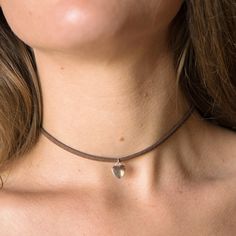 Introducing our Western Style Simple Heart Choker Necklace - a harmonious blend of bohemian charm and minimalist elegance. 🌿✨ This dainty piece, adorned with a tiny silver heart charm, exudes a free-spirited vibe, making it your perfect everyday accessory. Crafted with love, this necklace features a unique combination of Vegan Leather and stainless steel hardware, ensuring both style and sustainability. The hypoallergenic stainless steel makes it a comfortable choice for all skin types. Choose Heart Choker Necklace, Western Necklaces, Thread Necklace, Heart Choker, Moissanite Necklace, Hippie Necklace, Leather Chokers, Everyday Accessories, German Silver