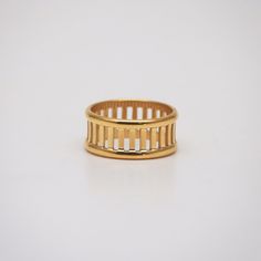 This highly polished gold band ring has a classic and simple look with multiple bars attaching two outer rails. 18k gold plated Stainless steel base Waterproof and tarnish free Available in US size 6-8 Ring sizing chart Man Jewelry, Hollow Ring, Dainty Rings, Rope Rings, Reunion Island, Bar Ring, Open Bar, Gold Band Ring, Cz Ring