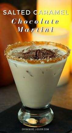 salted caramel chocolate martini is served in a glass with whipped cream and garnish