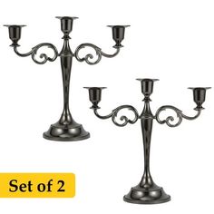 a set of three metal candlesticks sitting on top of each other