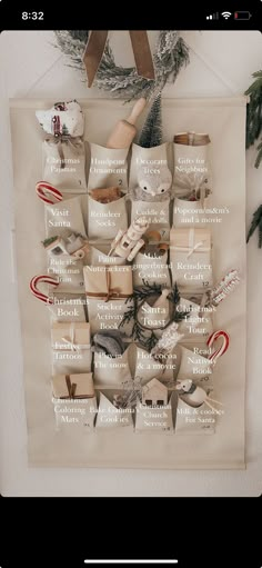 a christmas tree with presents wrapped in white paper