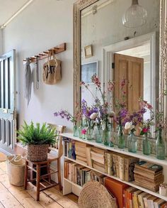 a room filled with lots of books and flowers