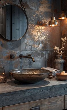 a bathroom sink sitting under a mirror next to a wall mounted faucet with lights on it