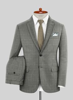 If you're truly fashionably inclined, an infusion of our Scabal Cosmopolitan Glen Gray Wool Suit is essential. Tailored with superfine merino wool, this distinguished suit showcases a plaid pattern crafted from intersecting lines of black and white yarns, all resting on a gray foundation. Moreover, it offers exceptional versatility for your wardrobe, making it perfect for various occasions such as weddings, proms, or even a day at the races.  Look Includes    Scabal Cosmopolitan Glen Gray Wool Plaid Wool Suit With Notch Lapel, Semi-formal Plaid Wool Suits, Luxury Plaid Single Breasted Suit, Elegant Plaid Business Suit, Timeless Plaid Suit With Notch Lapel, Business Plaid Wool Suit, Timeless Plaid Suits With Notch Lapel, Plaid Wool Business Suit, Plaid Wool Suits For Business