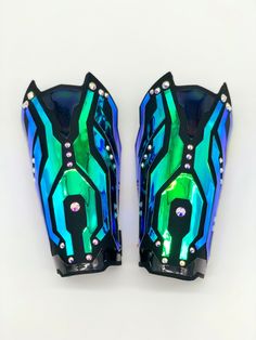 two blue and green motorcycle fairings on white background