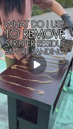 a woman is sanding on a table with the words what do i use to remove striper residue before sanding?