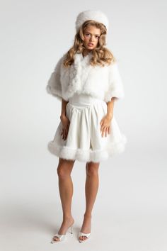 Chic Fluffy Fur Coat For Spring, Chic Fluffy Fur Coat, White Faux Fur Outerwear With Feather Trim, Spring Fluffy Faux Fur Coat, Spring Faux Fur Coat With Faux Fur Trim, Chic Fitted Fluffy Fur Coat, Chic Fluffy Fitted Fur Coat, Fitted Winter White Faux Fur Coat, Winter White Fitted Faux Fur Coat