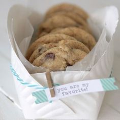 chocolate chip cookies in a paper container with a note on the side that says you are my favorite