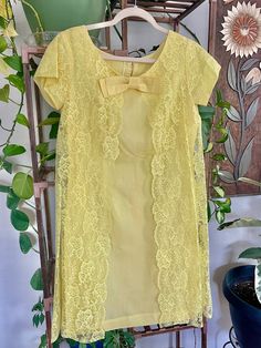 1950's Vintage Babydoll Dress  Excellent Vintage Condition!  Fits like a medium although no sizing tags Lace overlay with bow. Zip up back Vintage Babydoll Dress, Vintage Baby Doll Dress, 60s Babydoll Dress, 1960s Babydoll Dress, 60s Mini Dress Baby Dolls, Babydoll Dress Nightwear 60s, Lace Overlay, Babydoll Dress, Vintage Yellow