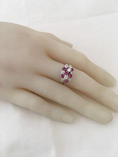 18K White Gold Ruby And Diamond Ring 6 Brilliant Cut AA quality Rubies 1ctw 8 Genuine Diamonds .88ctw SI2 clarity F Color Appraisal $8,000 Beautiful High Diamonds F color grade Rubies AA quality Gorgeous 18K Gold Ring Weighs- 5.2 grams Ring size - 7.25 Visit our shops on Etsy HauteCoutureLaLa TrendsCouture BeautifulPatina LastingTrends Combine shipping within the first three shops listedFree Shipping on orders over $35.00 however if there is a return buyer to refund seller for the free shipping Ruby Ring With Diamond Cluster And Brilliant Cut, Cluster Ruby Ring With Brilliant Cut Diamonds, Classic Ruby Ring With Diamond Accents Cluster, Classic Ruby Ring With Diamond Accents In Cluster Shape, Anniversary Ruby Ring With Vs Clarity, Anniversary Ruby Ring With Vs Clarity And Round Cut, Cluster Diamond Ring With Vvs Clarity And Ruby, Anniversary Ruby Cluster Ring With Vvs Clarity, Ruby Cluster Ring With Vvs Clarity For Anniversary