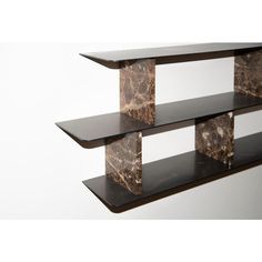 three tiered shelf with marbled edges against a white background, one is black and the other is brown