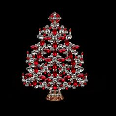 a christmas tree made out of red and silver jewels