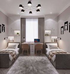 a bedroom with two twin beds and a desk