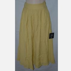 This Skirt Is Size Xs And Made By Lulus. It Is New With Tags, Might Have Some Wrinkling With Shipping. It Is Made With 75% Rayon And 25% Polyester And Hand Washable. It Is Fully Lined And Have A Hidden Zipper On The Side Of The Waist. The Waist Measures About 12" Across And It Is 31" In Length. Very Nice Skirt. Casual Yellow Wide Leg Skirt, Casual Wide Leg Yellow Skirt, Casual Mustard Skirt, Yellow Skirt With Elastic Waistband For Day Out, Yellow Long Skirt For Summer, Yellow Relaxed Skirt Bottoms With Elastic Waistband, Yellow Stretch Skirt For The Beach, Yellow Stretch Skirt For Beach, Mustard Summer Skirt