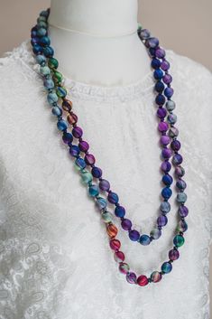 Indulge in the exquisite artistry of Vietnam with this handcrafted silk bead necklace. Carefully woven by skilled artisans, this necklace boasts vibrant colors and intricate patterns, each bead delicately threaded onto lustrous silk threads. Its elegant design reflects the rich cultural heritage of Vietnam, making it a captivating accessory that effortlessly combines tradition with modern style. Elevate any outfit with the unique beauty and craftsmanship of this stunning silk bead necklace, a te Silk Necklace, Habotai Silk, Rainbow Necklace, Statement Jewellery, Necklace Turquoise, Silk Thread, Style Moderne, Bead Necklace, Wood Beads