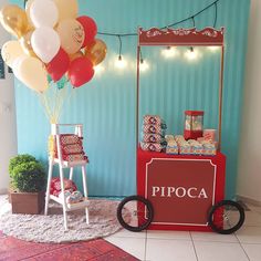 there is a cart with balloons on it and a sign that says pipoca