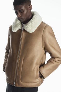 A shearling jacket is one of the menswear pieces that have truly stood the test of time, so consider it a sound investment for your wardrobe. Blending our signature house style with classic aviator influences, this one is designed with a pointed collar, front pockets, durable leather-bound edges and a double-ended zip closure. It is crafted from the most supple grained leather that will develop a unique patina over time and can be worn on the camel-hued side, or reversed to have the plush shearl Sheepskin Jacket, Leather Pocket, Quilted Bag, Shearling Jacket, Women's Coats & Jackets, Leather Working, Blending, Investment, Coats For Women