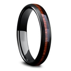 black ceramic ring with wood inlays and an orange stripe on the inside of it