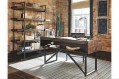 a living room filled with furniture and bookshelves next to a large brick wall