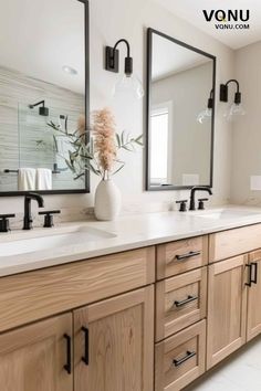 a large bathroom with double sinks and mirrors