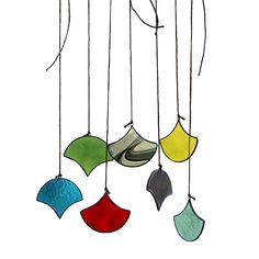 an image of a wind chime that is hanging from the ceiling with different colors