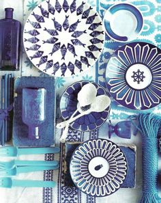 various blue and white items are arranged on a table