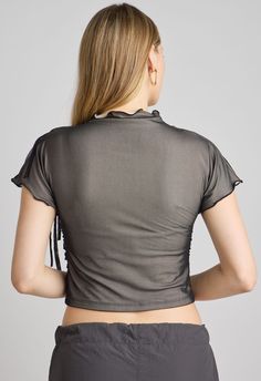 One Size. Fits XS-MColor: Powder/BlackMesh Top LayerThree Ties on Shoulder RuchingLettuce Edge TrimSoft Stretchy LiningSlightly Cropped65% Polyester 30% Rayon 5% SpandexDry Clean OnlyBy The NKC Store Product Measurements:Width: 40.64cm / 16inLength: 43.18cm / 17inSleeve Length: 11.43cm / 4.5in Model is 173cm / 5'8" wearing Size O/S Black Ruched Nylon Top, Elegant Fitted Nylon Tops, Black Nylon Mesh Top With Sheer Sleeves, Black Mesh Top With Sheer Sleeves In Nylon, Fitted Ruched Tops In Polyamide, Fitted Ruched Polyamide Tops, Fitted Nylon Mesh Top For Evening, Fitted Ruched Mesh Top For Party, Ruched Polyamide Tops