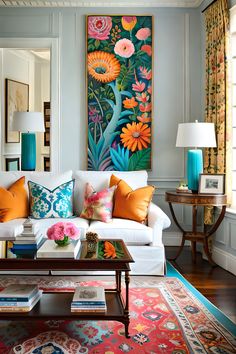 a living room filled with furniture and colorful paintings on the wall above it's windows