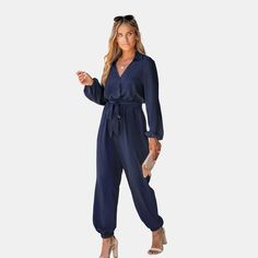 Step into the world of chic comfort with this Midnight Blue Belted Jogger Jumpsuit from Cupshe! The jumpsuit features a surplice neckline, front belt, long sleeves and jogger leg design. This versatile one-piece wonder is like a midnight sky wrapped in pure coziness, ensuring you'll look effortlessly stylish while feeling as comfy as stargazing in your pajamas. Product code: CAA13E3J010TT Fall Solid Color Belted Jumpsuits And Rompers, Solid Belted Jumpsuits And Rompers For Fall, Belted Long Sleeve Jumpsuits And Rompers For Spring, Casual Long Sleeve Belted Jumpsuits And Rompers, Belted Long Sleeve Jumpsuits For Spring, Spring Long Sleeve Jumpsuits And Rompers With Tie Waist, Chic Blue Belted Jumpsuits And Rompers, Belted Long Sleeve Jumpsuits And Rompers For Work, Blue Long Sleeve Jumpsuits And Rompers For Fall