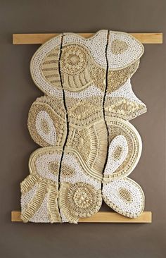 an intricately designed wall hanging made out of woven material