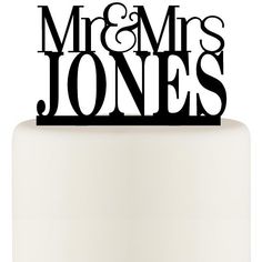 a wedding cake topper that says mr and mrs jones on it's side