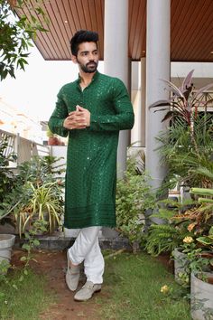 Kzari Green Self-Embroidered Kurta with Sequence The Kzari Green Self-Embroidered Kurta is an exquisite piece of traditional attire that exudes elegance and style. Crafted from high-quality silk, this kurta features a stunning green color adorned with intricate self-embroidery and delicate sequence detailing, creating a captivating and luxurious look. Features: Luxurious Silk Fabric: Made from premium silk for a soft and comfortable feel. Intricate Self-Embroidery: Exquisite embroidery for added elegance. Delicate Sequence Detailing: Sparkling sequence embellishments for a touch of glamour. Green Color: A vibrant and eye-catching hue. Versatile Styling: Can be paired with various bottoms and accessories. Suitable for Occasions: Perfect for festive and formal events. Specifications: Brand: Traditional Attire, Green Cotton, Silk Fabric, Formal Event, Green Color, Green Colors, Embellishments, Festival, Silk