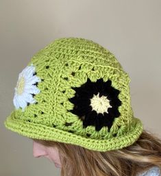 This handmade granny square crochet bucket hat is the perfect accessory to add a pop of color and style to any outfit. Made with care and attention to detail, each hat is crafted with a unique combination of colorful granny squares, creating a one-of-a-kind look. Whether you're running errands, lounging by the pool, or attending a music festival, this versatile hat is the perfect addition to your wardrobe. Care Instructions: Machine washable in cold water. Gentle cycle recommended. Lay flat to d Retro Crochet Hat For Spring, One Size, Retro One Size Crochet Hat For Spring, Trendy Green Crochet Hat, Retro One-size Crochet Hat For Spring, Retro Spring Crochet Hat, Retro Spring Crochet Hat, One Size, Vintage Multicolor Crochet Hat For Spring, Trendy Handmade Green Crochet Hat, Handmade Retro Crochet Hat For Winter