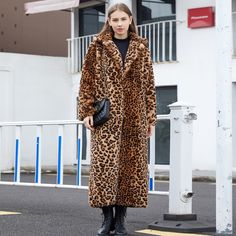 Make a bold fashion statement with this Leopard Print Faux Fur Long Coat. Crafted for those who want to stand out, this coat features a striking leopard print pattern and a luxurious faux fur exterior. With its long length, it's the ideal choice for adding a touch of glamour and wild sophistication to your outfit. Step into the spotlight with this trendy faux fur coat that commands attention and exudes confidence. Faux Fox Fur Coat, Fur Trench Coat, Celana Kargo, Long Suit, Long Faux Fur Coat, Plush Coat, Suit Collar, Leopard Print Coat, Women Coat