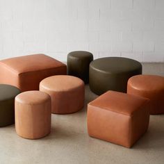 several different colored stools sitting next to each other