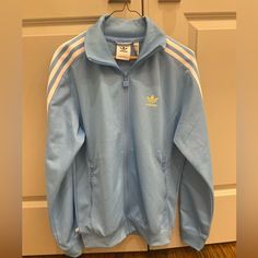 Adidas Small Light Blue Striped Track Suit Top Men’s New Never Worn With Tag Zip Up Two Zip Up Pockets Collar Fb Nations Tt Machine Washable Feel Free To Message Me If You Have Any Questions (I Don’t Email) Blue Cotton Long Sleeve Track Jacket, Casual Blue Adidas Outerwear, Classic Long Sleeve Track Jacket For Spring, Blue Adidas Track Jacket For Spring, Adidas Blue Track Jacket For Spring, Adidas Fitted Track Jacket For Spring, Classic Light Blue Long Sleeve Outerwear, Spring Adidas Fitted Track Jacket, Blue Fitted Casual Track Jacket