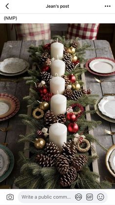 the table is set with pine cones and candles