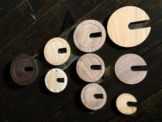 several different types of woodworking tools on a wooden surface with holes in the middle