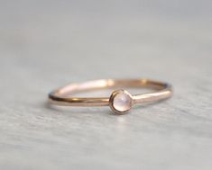 Beautiful birthstone stacking rings. Made in 14k rose gold filled and stone is a 3mm genuine rainbow moonstone. This ring is made to order in your size. If you don't see your size available please feel free to message me. All orders ship in a gift box. If you are ordering multiple items and want them boxed separately, please let me know in the notes at checkout. I ship via USPS. Please review the estimated delivery date and processing times. Processing times vary based on how busy my shop is at Rose Gold Moonstone Ring With Birthstone, Rose Gold Moonstone Birthstone Ring, Delicate Rose Gold Moonstone Ring With Birthstone, Dainty Rose Gold Moonstone Ring, Delicate Rose Gold Moonstone Birthstone Ring, Stackable Rose Gold Moonstone Ring For Anniversary, Rose Gold Stackable Moonstone Ring For Anniversary, Stackable Rose Gold Moonstone Ring, Stackable Round Moonstone Ring In Rose Gold