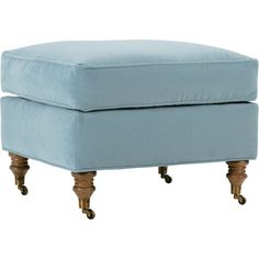 a blue ottoman sitting on top of a wooden frame