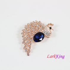 "LarkKing BH107 Brooch, peacock brooch, crystal peacock brooch, rhinestone peacock brooch, pearl peacock brooch, fashion jewelry, women gift, brooch gift, birthday gift. Material: brass metal, rhinestone crystals Size: 1 3/8\"x 2 3/8\" (width x height) Weight: 14.2 g (0.66 OZ) Five colors are available. To select color from drop down menu \"To Select Color\": Dark Blue color: BH107A Red color: BH107B Brown color: BH107C Blue color: BH107D Light brown color: BH107E Gift box is available at https: Elegant Peacock Design Brooch For Formal Wear, Elegant Party Brooch With Peacock Design, Elegant Peacock Color Wedding Brooches, Peacock Brooch Handmade, Elegant Peacock-colored Brooches For Wedding, Peacock Brooch, Brooch Fashion, Bridal Bouquet Charms, Wedding Badges