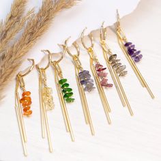 Raw Crystal Bar Drop Hoops, Colorful Birthstone Earrings Gift Daughter or Friend, Beaded Tassel Dangle Huggie Hoops, Long Bar Charm Huggies ✨ These earrings feature a beaded bar of genuine raw crystals & a 2-bar charm hanging from a dainty huggie hoop. Available in Gold finish. ✨ The simplicity of these earrings make them ideal gifts. They are lightweight and easy to match with your wedding color palette! Understated yet elegant, they can be paired with virtually any style of dress. PLEASE NOTE: These earrings are sold as SINGLES (1 Hoop total) or as PAIRS (2 Hoops total) --> Stacking Charm Hoops Available to Purchase HERE: https://www.etsy.com/listing/1522629950/ H O W ∙ T O ∙ O R D E R 1st DROP DOWN menu: * Select the GEMSTONE OPTION you would like 2nd DROP DOWN menu: * Select if you wou Clay Inspo, Quilling Work, Bridesmaids Earrings, Raw Crystals, Earrings Diy, Birthstone Earrings, Small Charms, Long Dangle Earrings, Birthstone Gifts