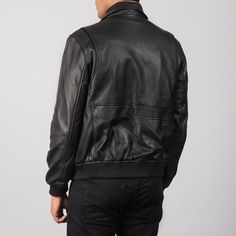 Introducing the ultimate in classic style and modern comfort: the Men's Black A2 Leather Bomber Jacket. Crafted from the highest quality leather and designed with both fashion and function in mind, this jacket is the perfect addition to any wardrobe. With its sleek black exterior and timeless design, this bomber jacket is a true fashion staple. The sturdy construction ensures durability and longevity, while the soft and supple leather provides unbeatable comfort and style. The ribbed collar, cuf